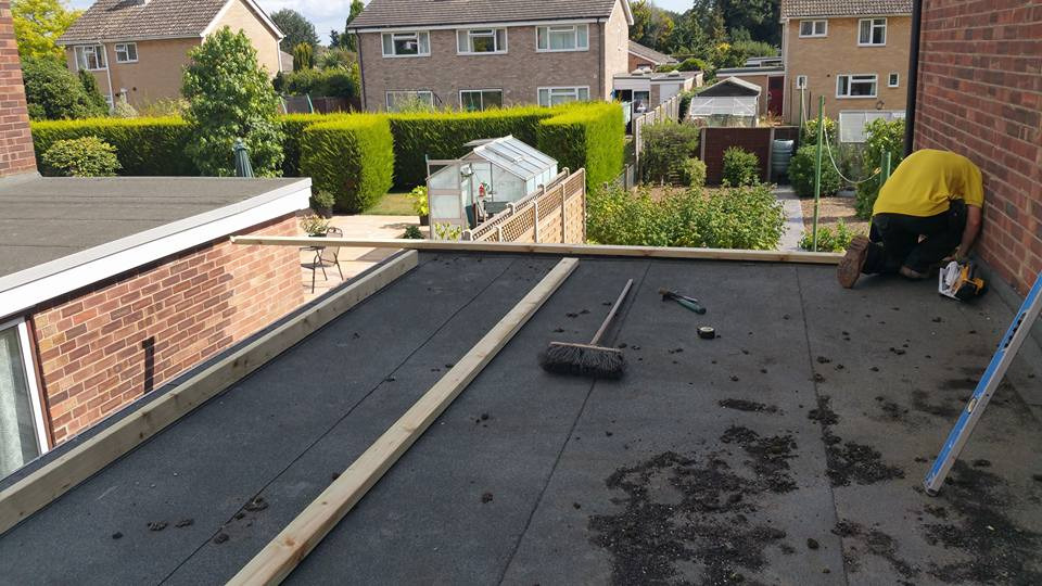 complete flat roof replacement service on commercial property building