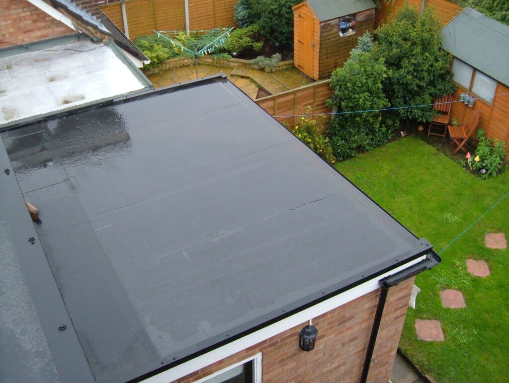 damaged roofing membrane assessed for flat roof repair vs replacement service