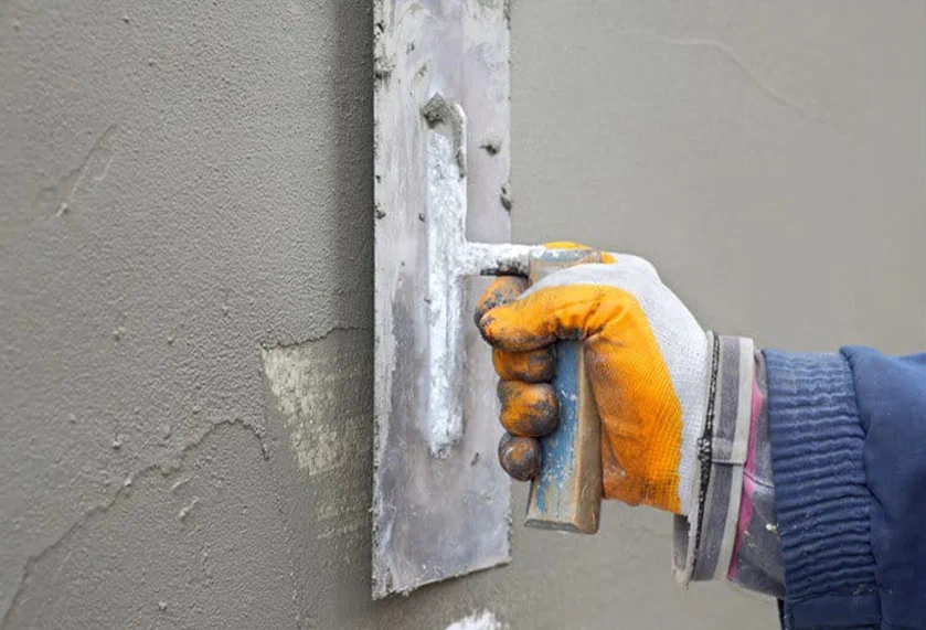stucco and masonry repair on older building exterior walls